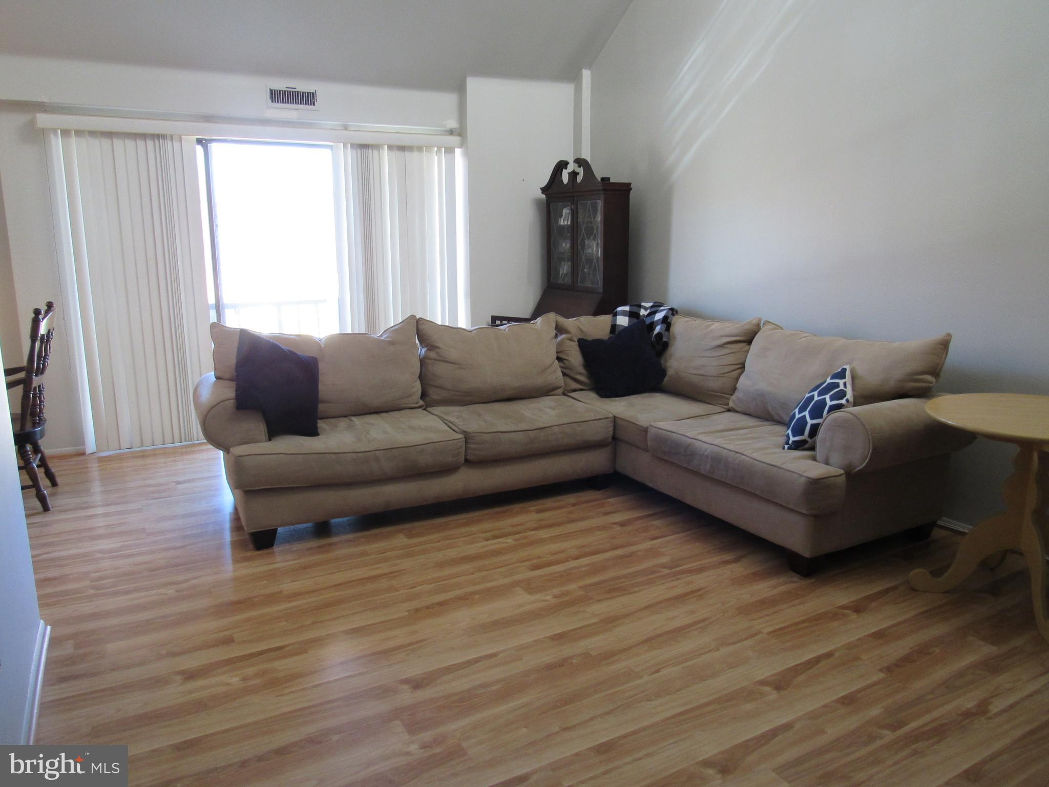 9585 James Street, Unit B Philadelphia, PA 19114 - Photo 4 of 26 a living room with furniture and a wooden floor