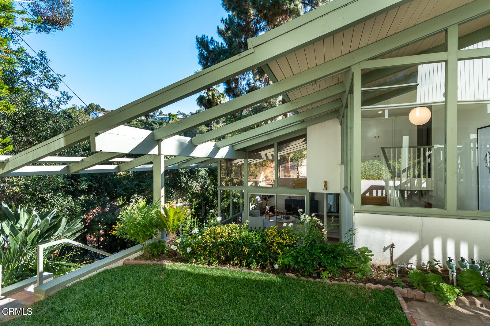1437 Hillside Drive Glendale, CA 91208 - Photo 3 of 29 a front view of a building with a yard and plants