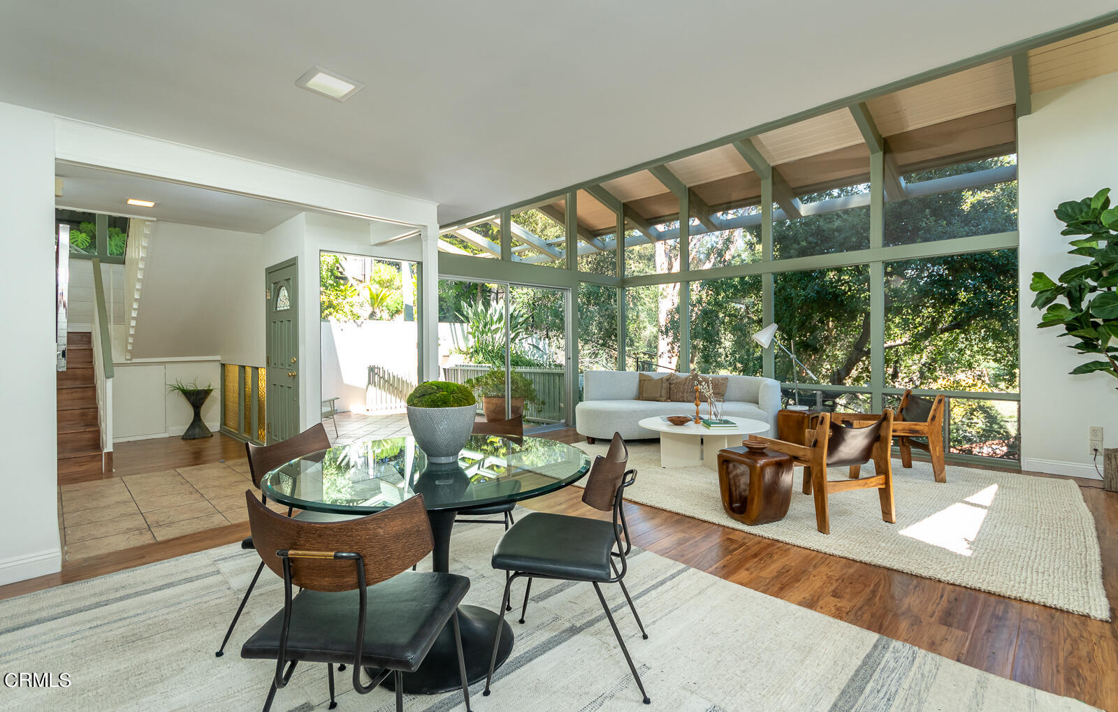 1437 Hillside Drive Glendale, CA 91208 - Photo 7 of 29 a dining room with furniture a chandelier and wooden floor