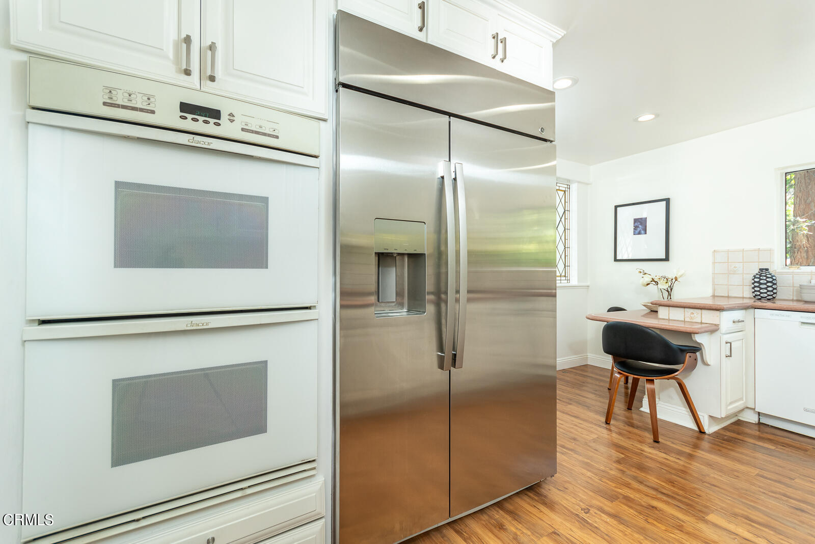 1437 Hillside Drive Glendale, CA 91208 - Photo 10 of 29 a kitchen with a refrigerator and a stove top oven