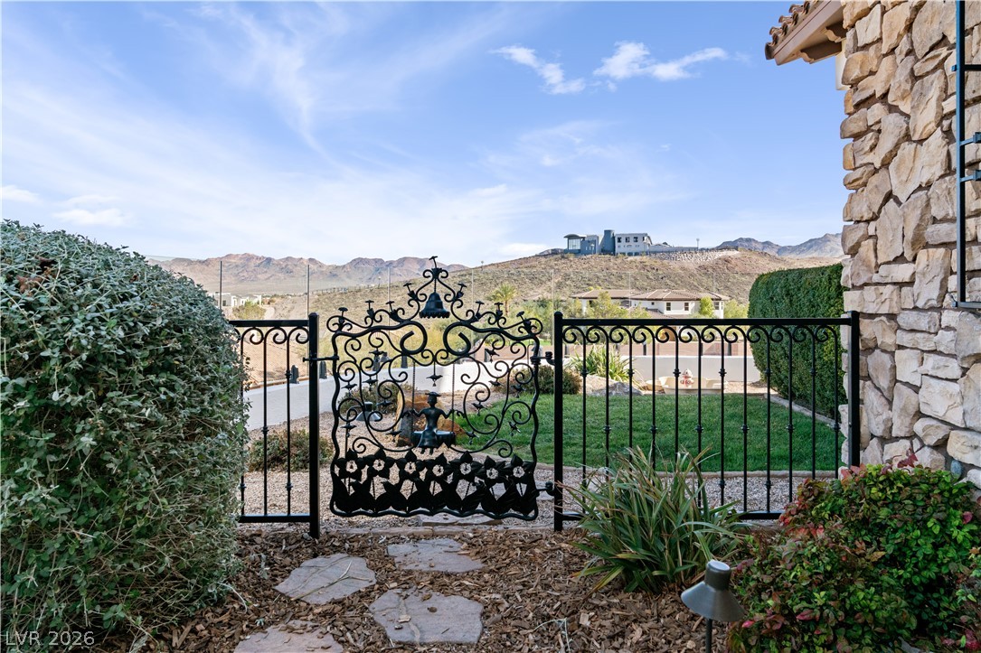 1123 Christian Road Henderson, NV 89002 - Photo 64 of 94 Ornate wrought iron gate opens to mountain vistas and manicured lawns.