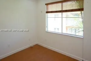 a view of a window in an empty room