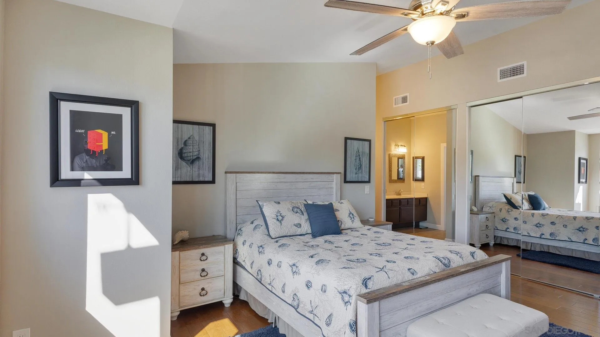 388 Compass Road Oceanside, CA 92054 - Photo 12 of 15 a bedroom with a bed and a chandelier