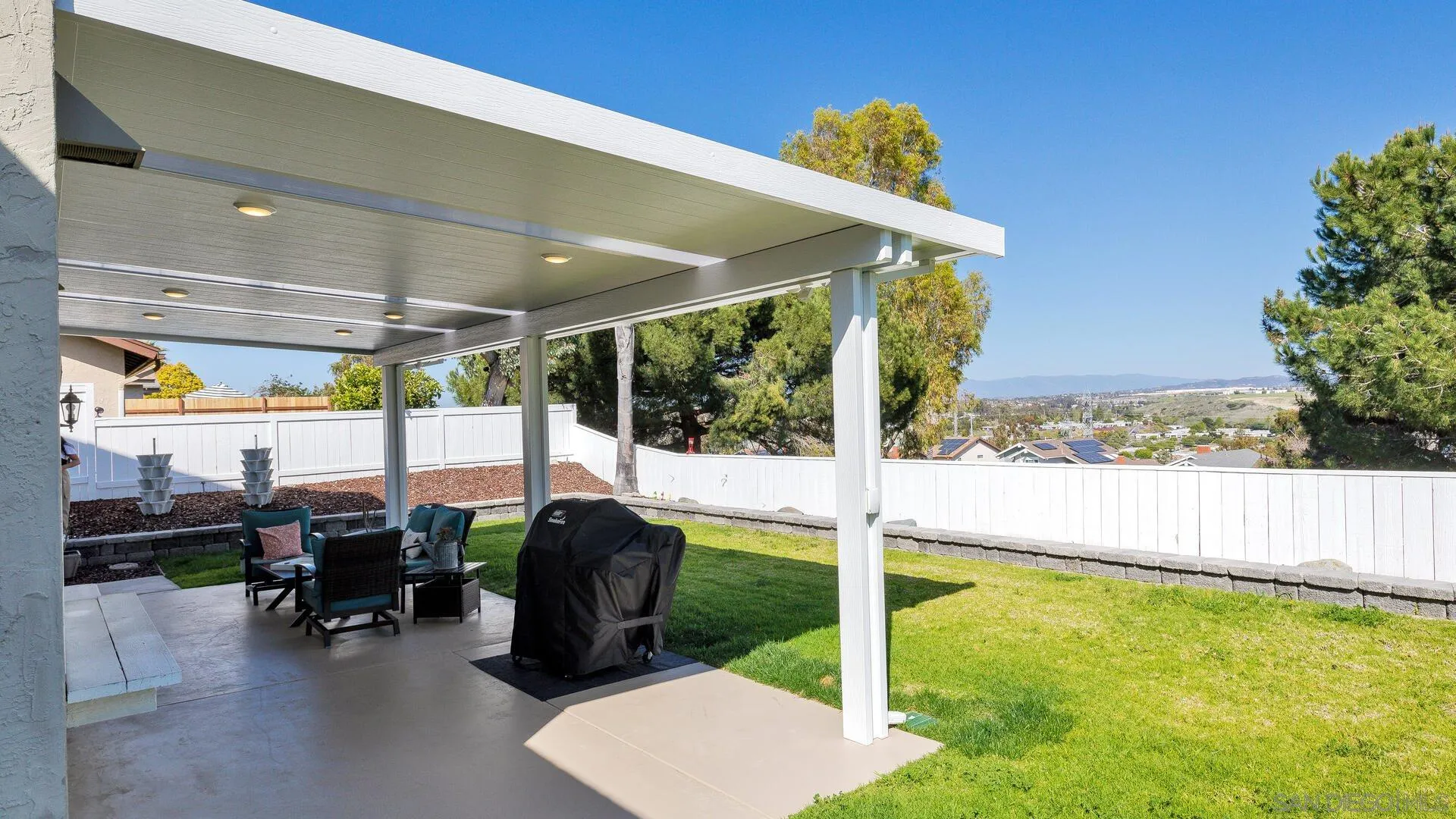 388 Compass Road Oceanside, CA 92054 - Photo 14 of 15 a view of a patio with a table and chairs