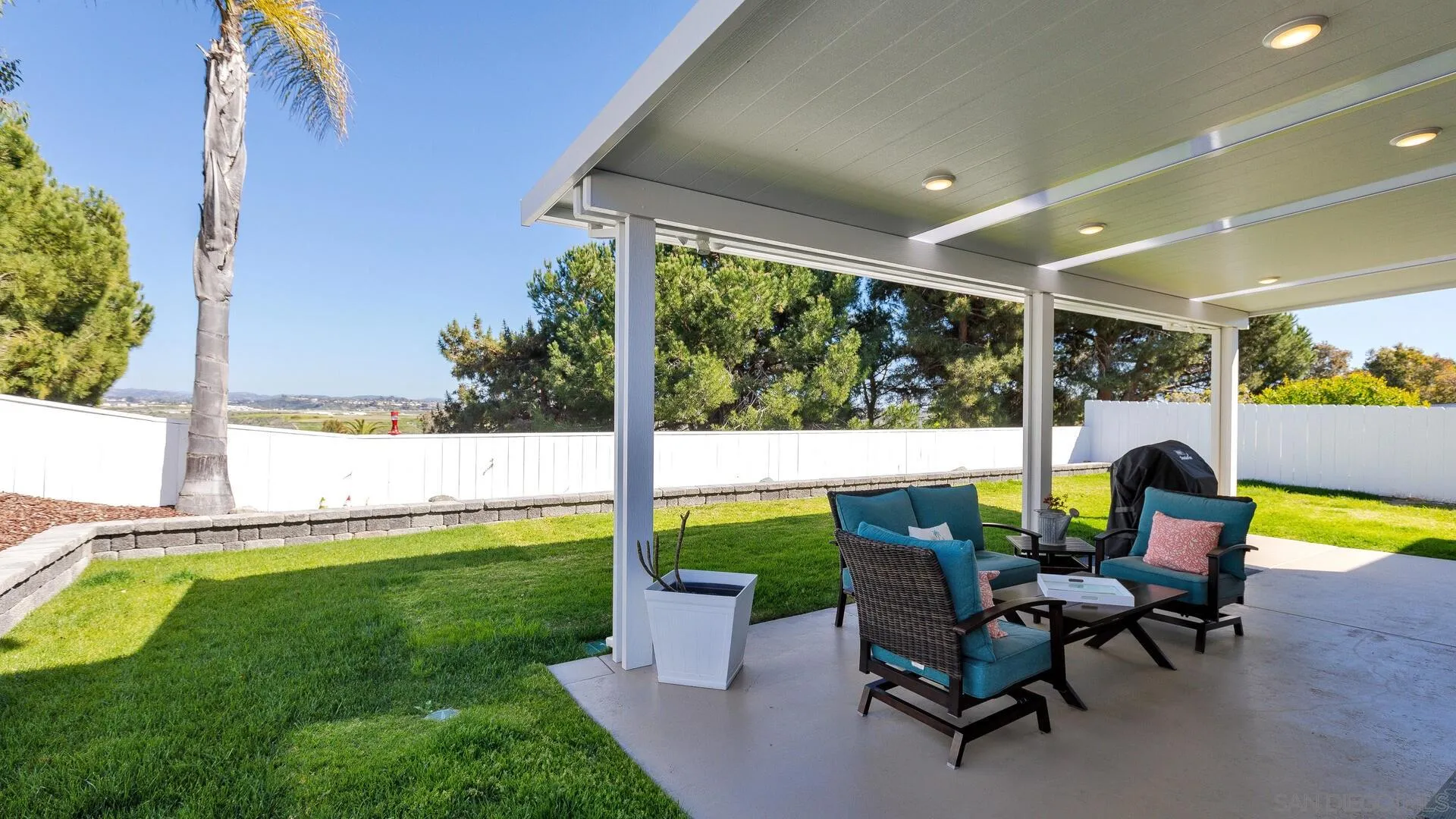 388 Compass Road Oceanside, CA 92054 - Photo 5 of 15 a house view with a sitting space and garden