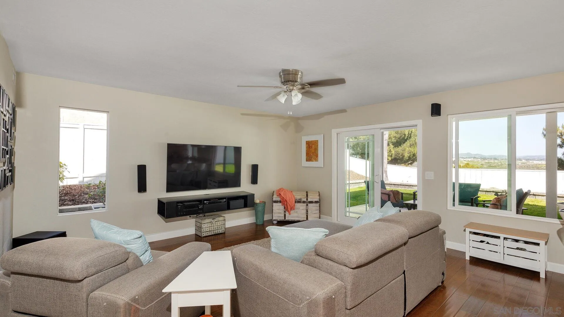 388 Compass Road Oceanside, CA 92054 - Photo 8 of 15 a living room with furniture and a flat screen tv