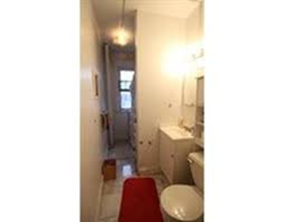 72 Strathmore Road, Unit 10 Boston, MA 02135 - Photo 2 of 9 a bathroom with a toilet
