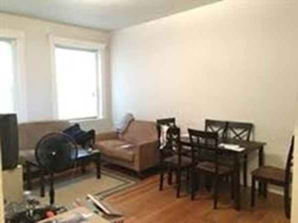 72 Strathmore Road, Unit 10 Boston, MA 02135 - Photo 3 of 9 a living room with furniture and a window