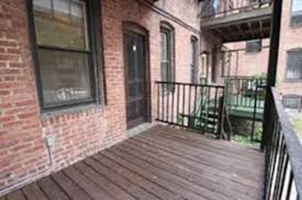 72 Strathmore Road, Unit 10 Boston, MA 02135 - Photo 8 of 9 a view of a house with wooden floor