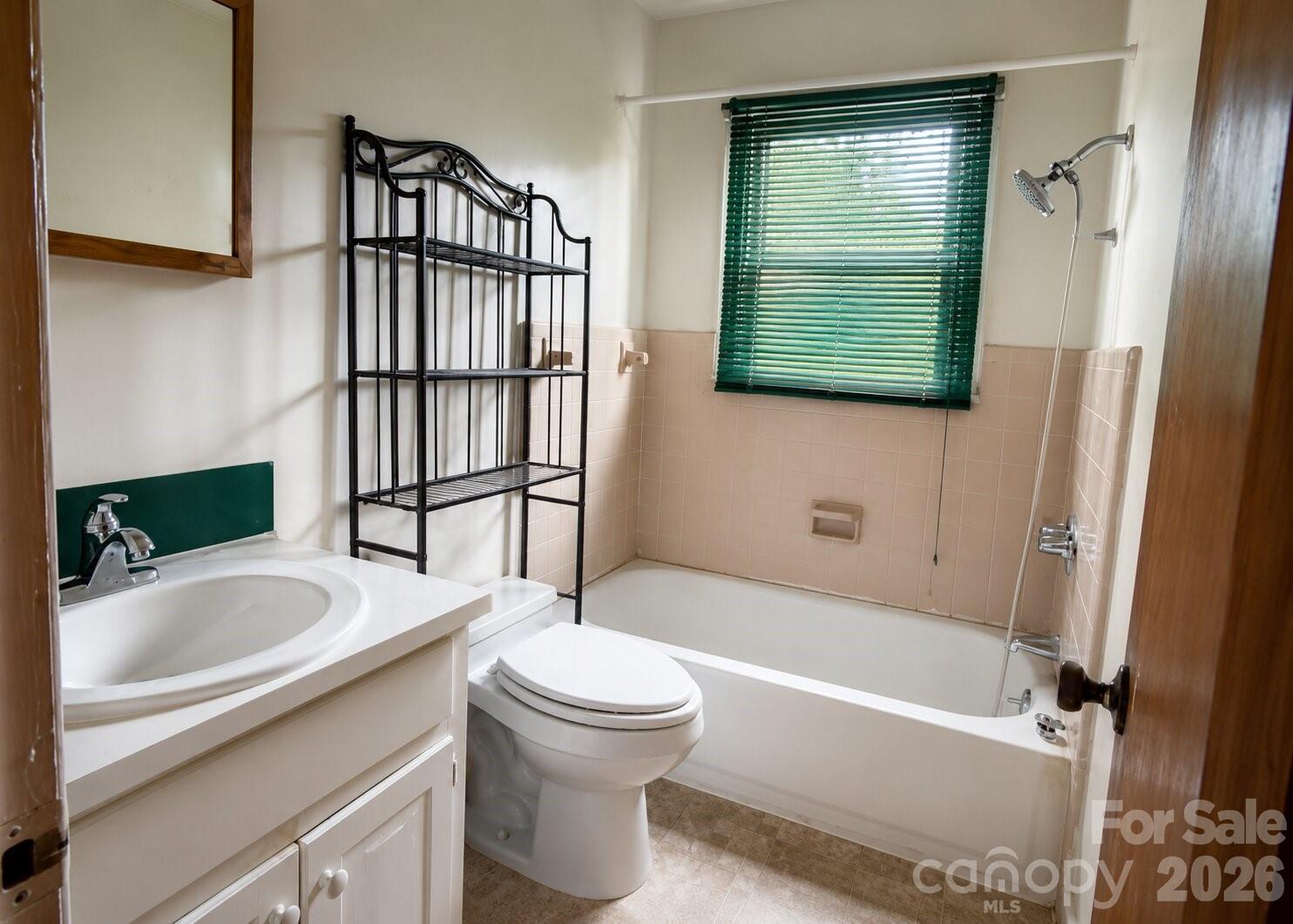 405 Isom Street Lancaster, SC 29720 - Photo 8 of 8 a bathroom with a sink a toilet and a bathtub