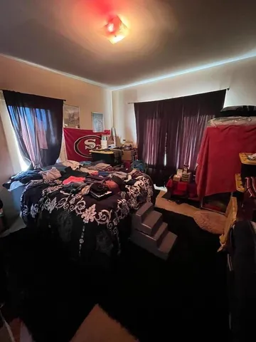 a bed room with bed and a closet