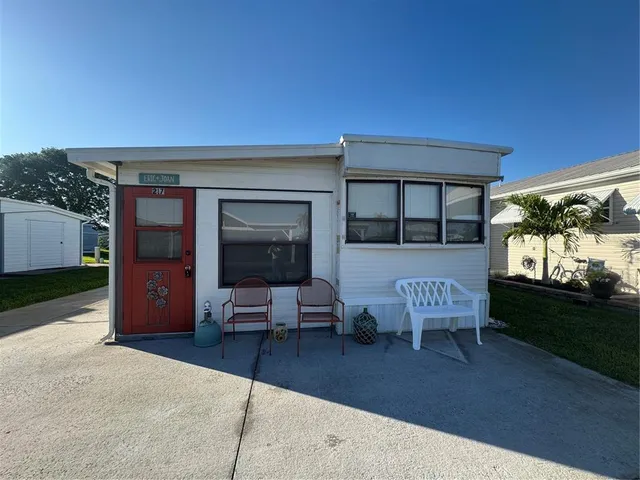 a view of a house with outdoor sitting space