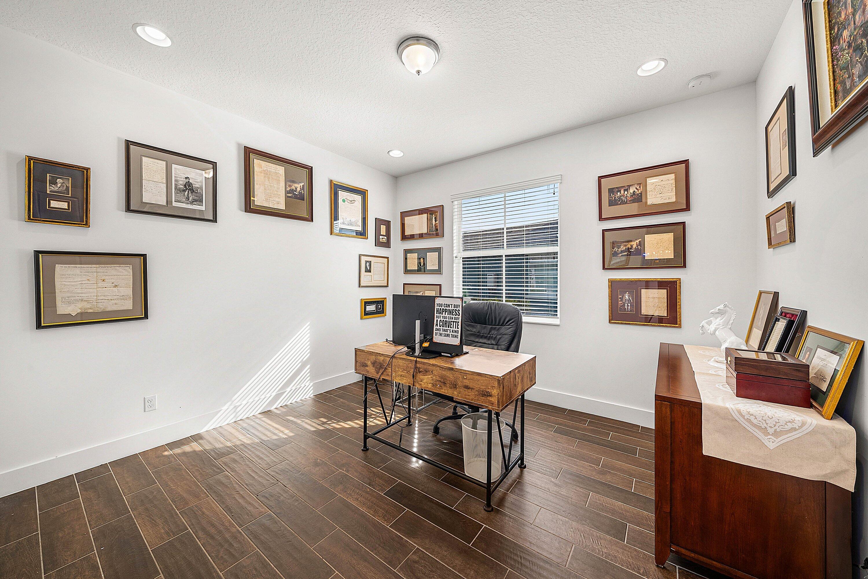 1107 Timber Reap Trail Loxahatchee, FL 33470 - Photo 18 of 83 a workspace with furniture window and wooden floor