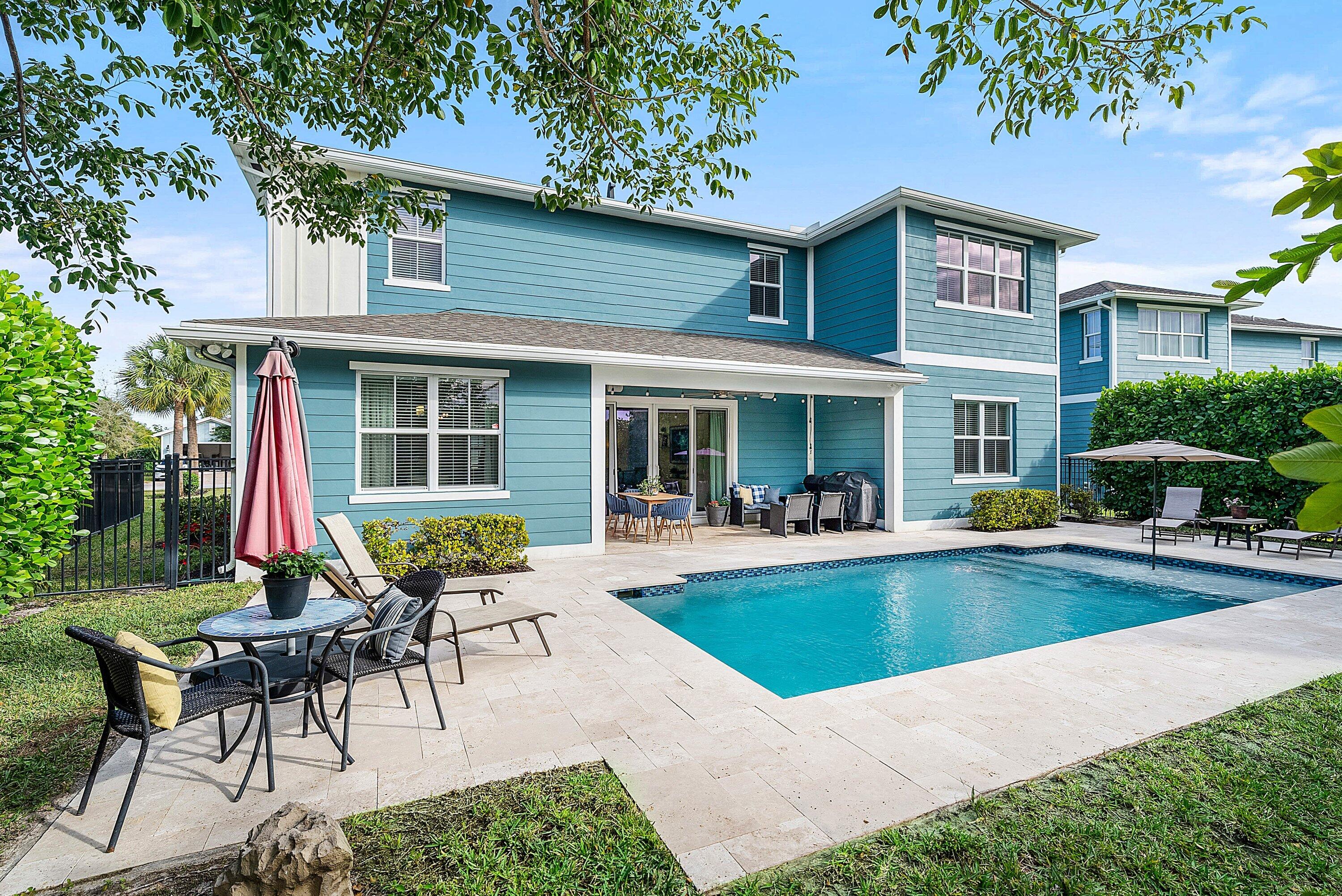 1107 Timber Reap Trail Loxahatchee, FL 33470 - Photo 39 of 83 a view of a house with a yard patio and swimming pool