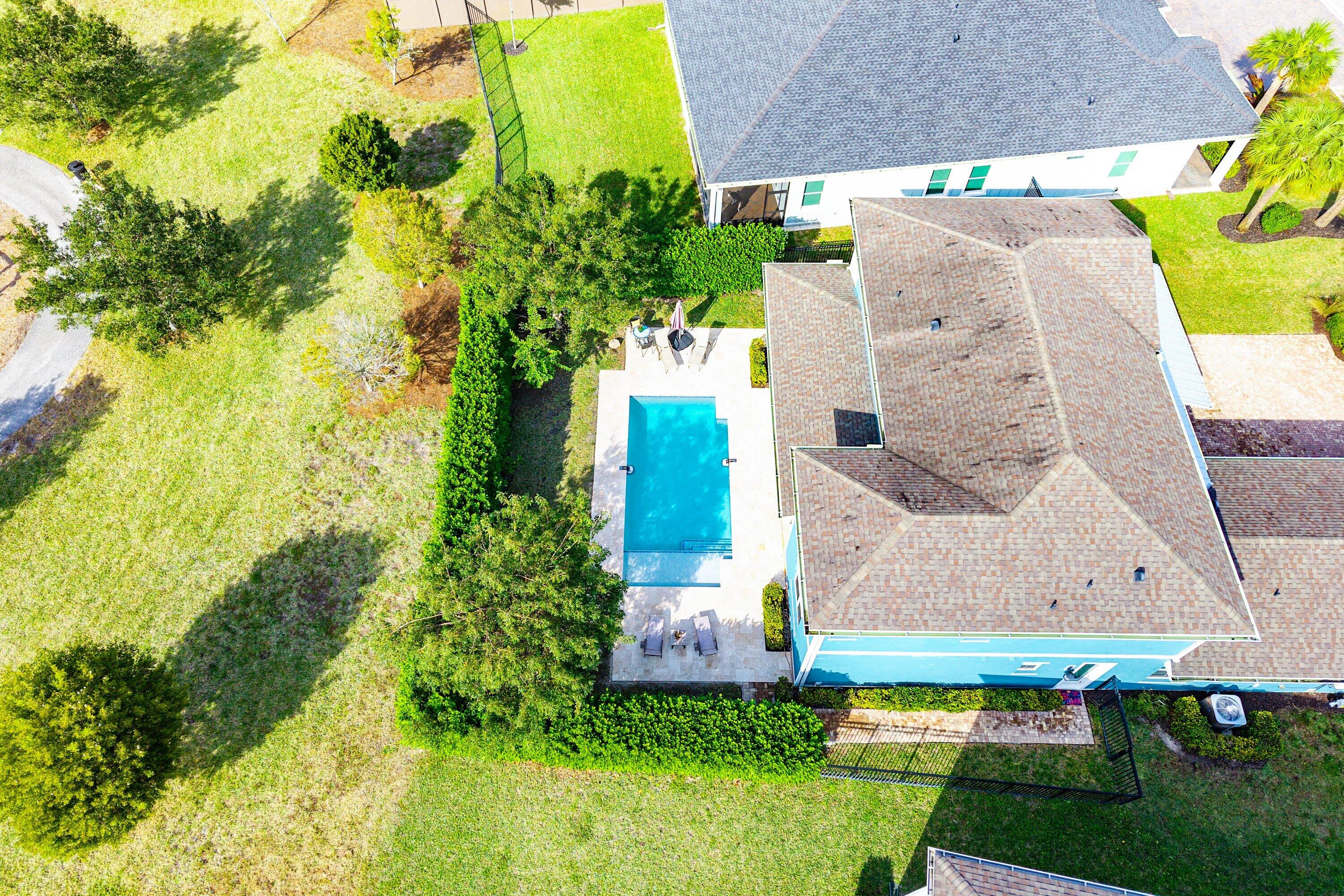 1107 Timber Reap Trail Loxahatchee, FL 33470 - Photo 46 of 83 an aerial view of a house with a garden and swimming pool