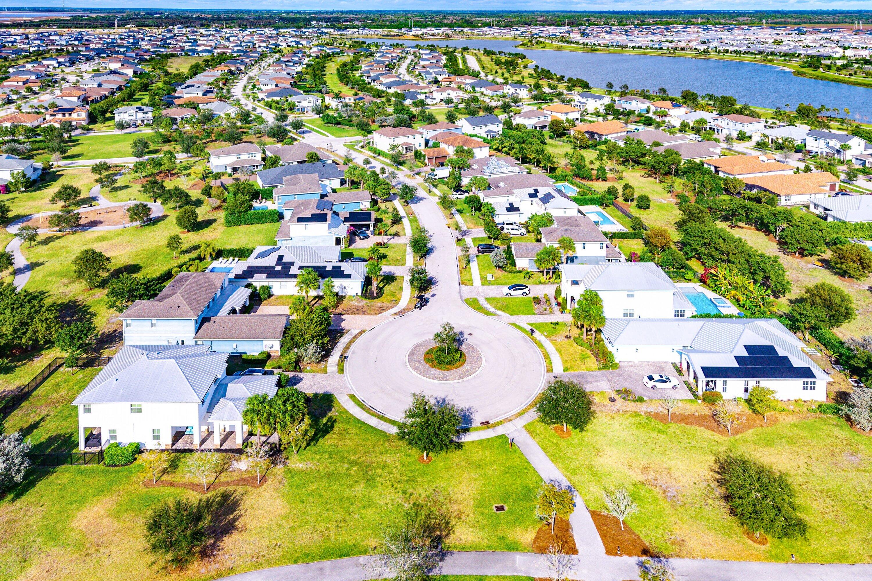 1107 Timber Reap Trail Loxahatchee, FL 33470 - Photo 50 of 83 an aerial view of residential houses with outdoor space and parking