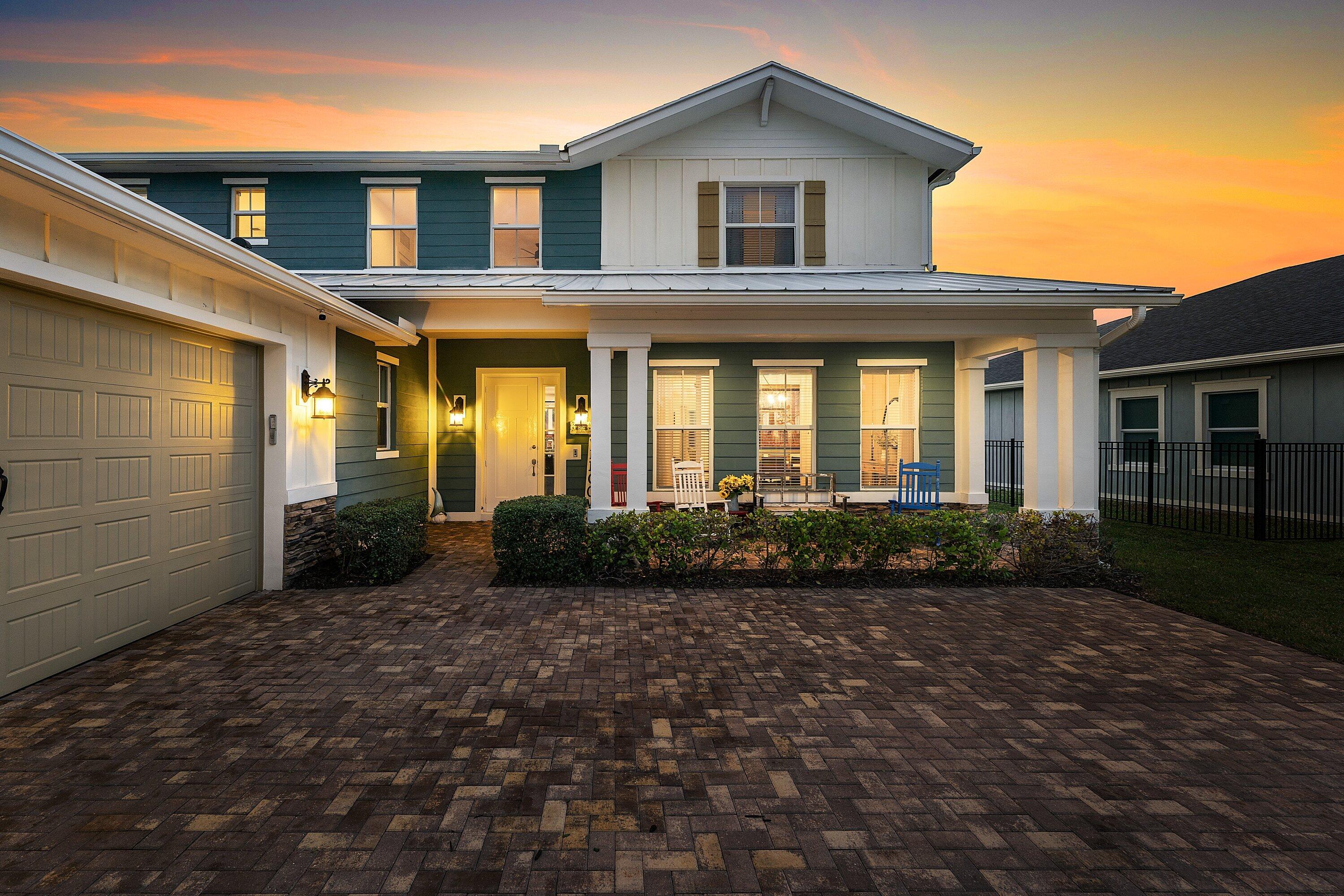 1107 Timber Reap Trail Loxahatchee, FL 33470 - Photo 57 of 83 a front view of a house with a garden