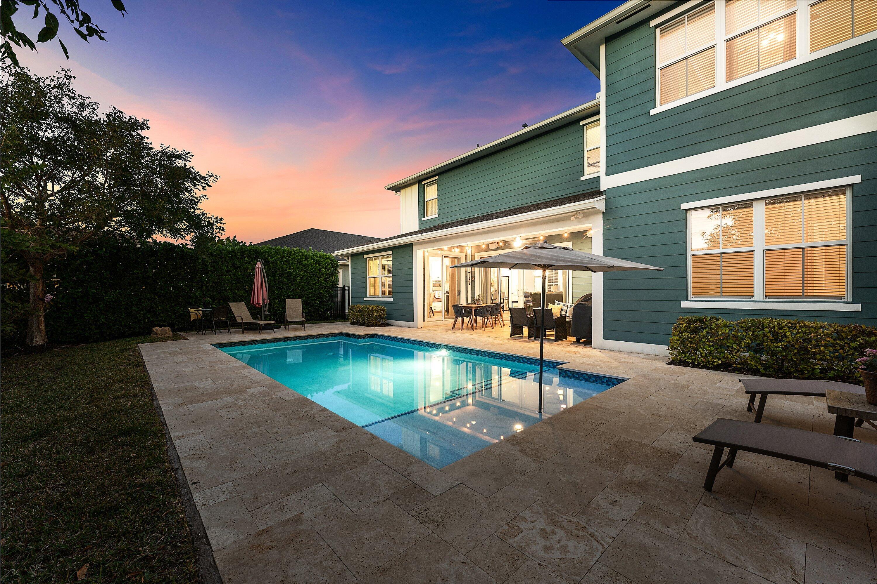 1107 Timber Reap Trail Loxahatchee, FL 33470 - Photo 60 of 83 a view of a patio with swimming pool table and chairs