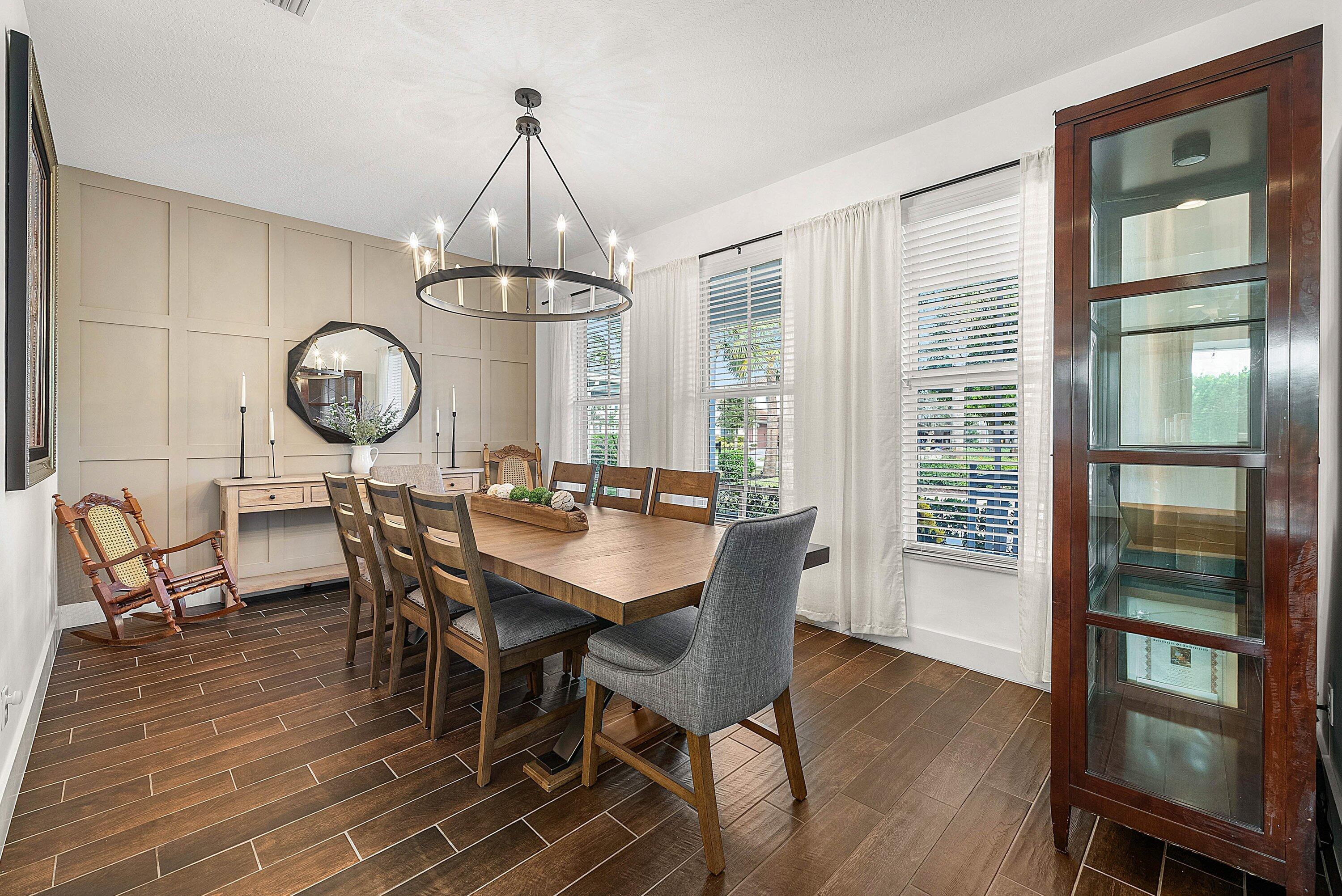 1107 Timber Reap Trail Loxahatchee, FL 33470 - Photo 6 of 83 a view of a dining room with furniture window and wooden floor