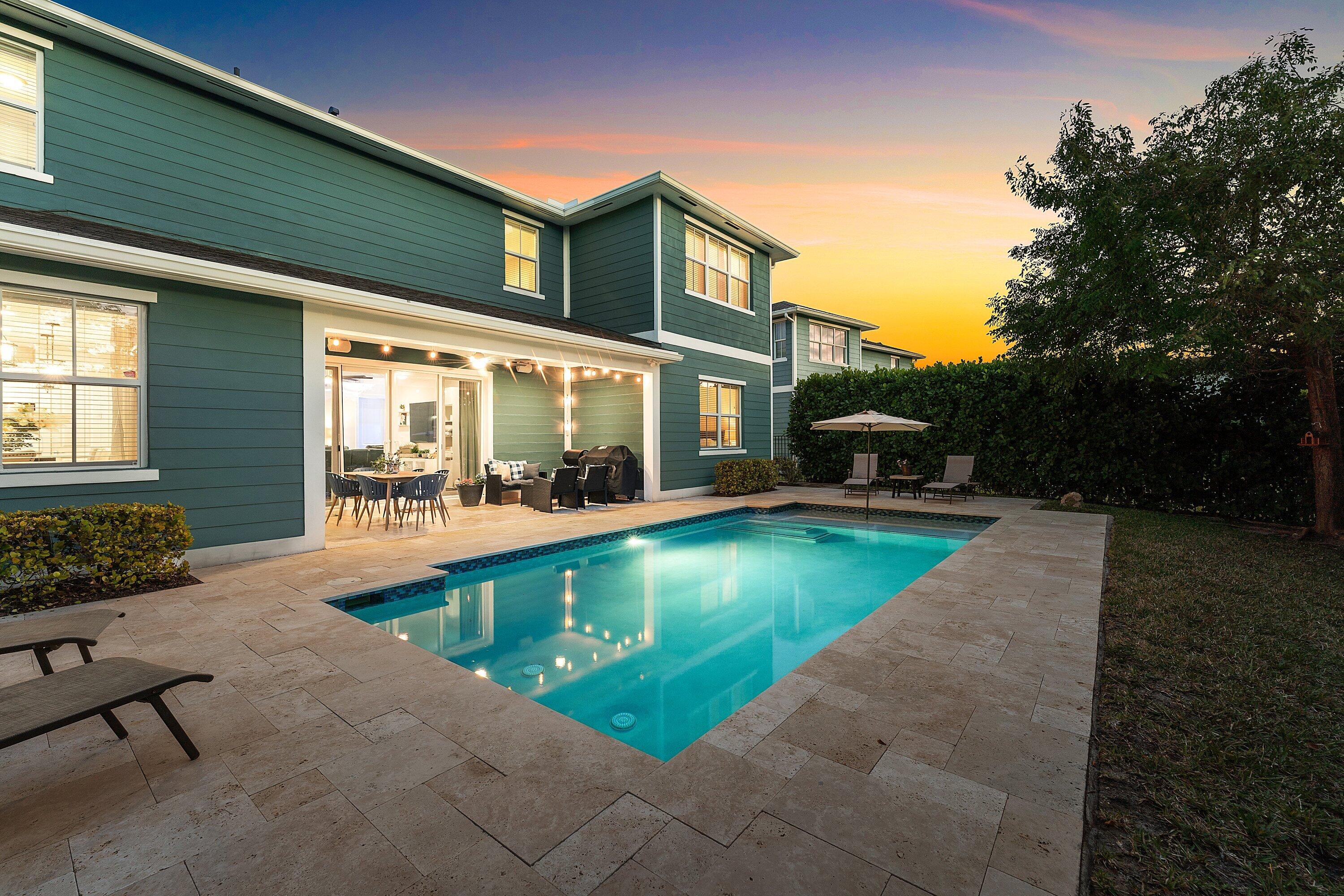 1107 Timber Reap Trail Loxahatchee, FL 33470 - Photo 61 of 83 a view of a patio with swimming pool table and chairs