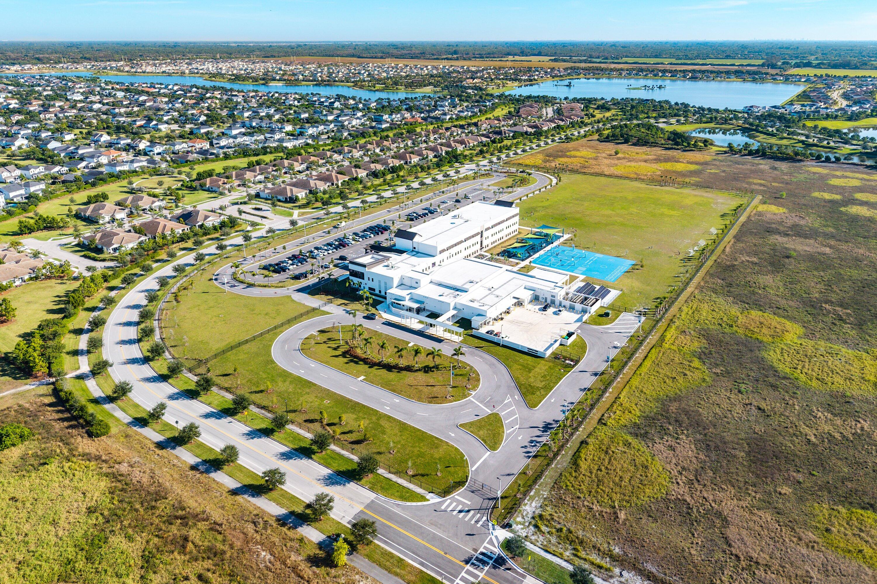 1107 Timber Reap Trail Loxahatchee, FL 33470 - Photo 67 of 83 a view of a swimming pool and an ocean view