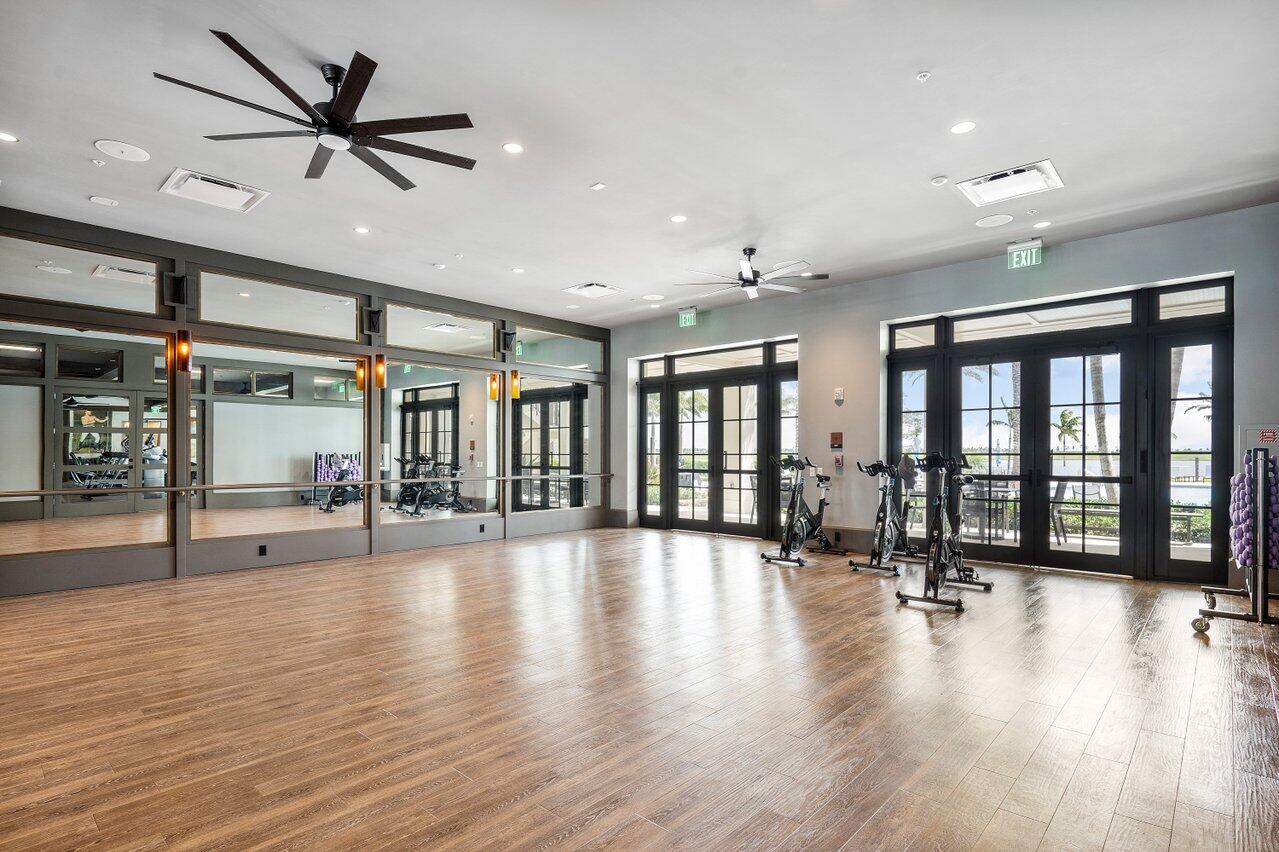 1107 Timber Reap Trail Loxahatchee, FL 33470 - Photo 78 of 83 a view of an room with wooden floor and a ceiling fan