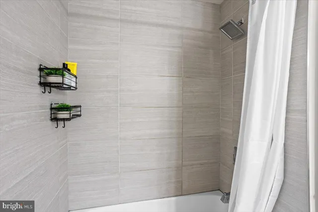 a bathroom with a sink vanity mirror and toilet