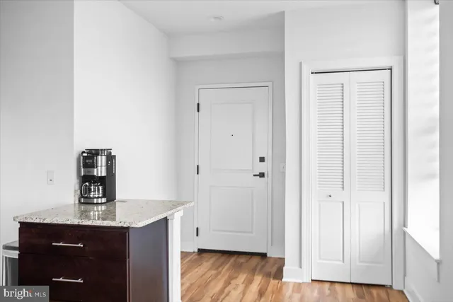 a view of kitchen with wooden floor