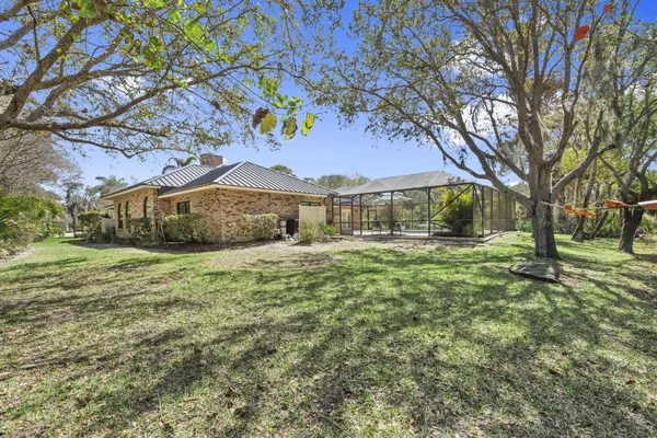 a living room with furniture a large window and a flat screen tv