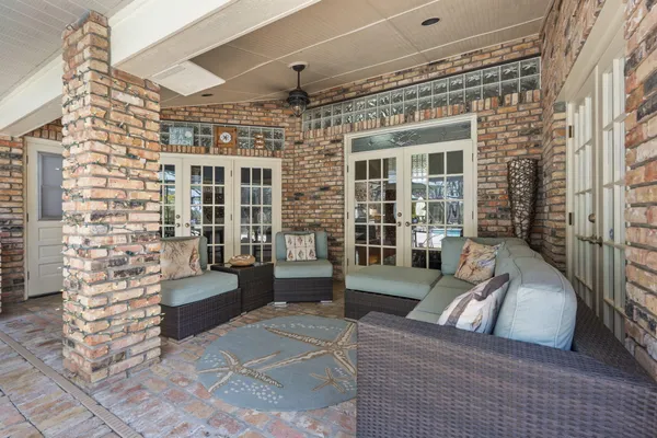 a front view of a house with a garden and yard