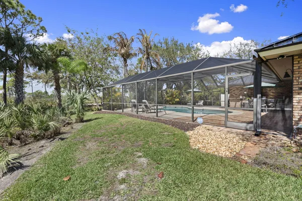 a bedroom with a bed and a lamp