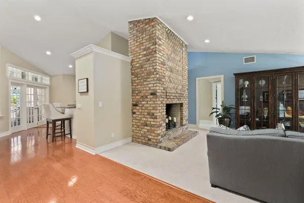 a bathroom with a granite countertop sink mirror and a bath tub