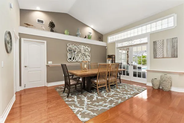 an aerial view of a houses with a yard