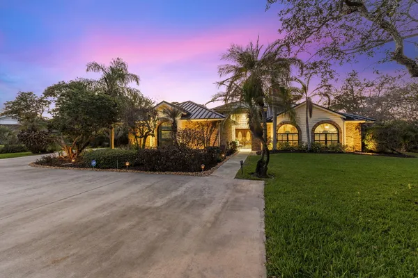 a view of a swimming pool with a patio