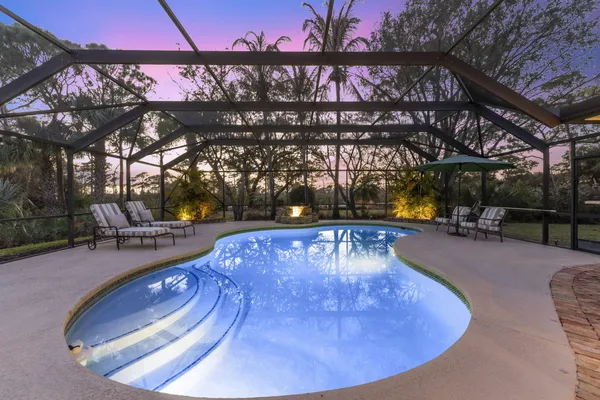 an aerial view of residential house with outdoor space and lake view