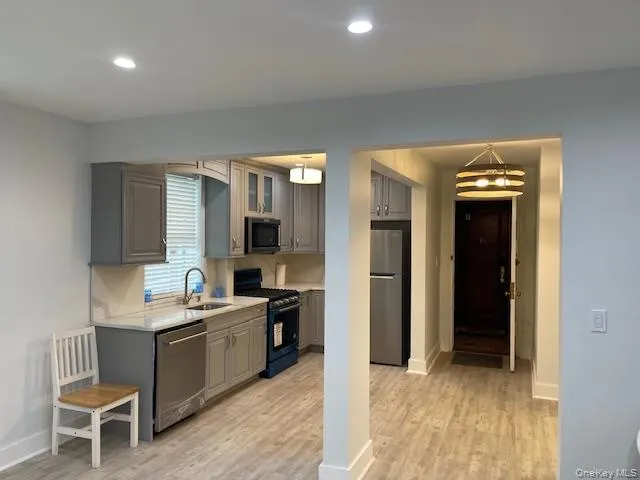 a room with a wooden floor and furniture