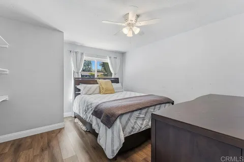 a view of an entryway with wooden floor