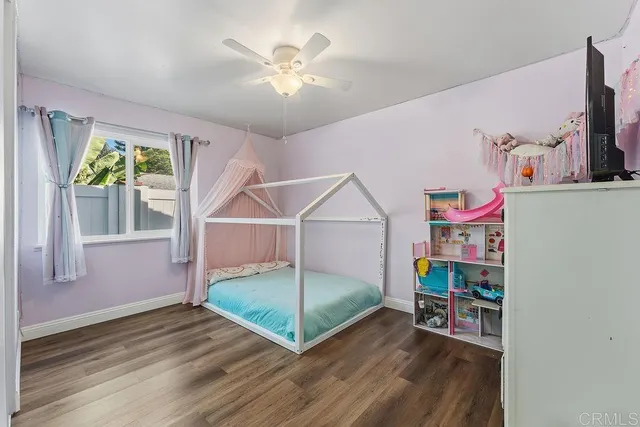 an aerial view of a house with a garden and trees