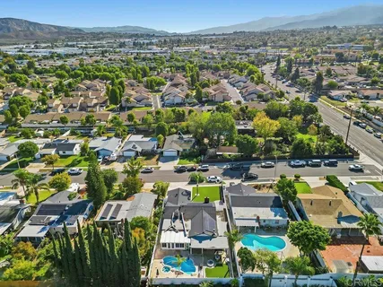 an aerial view of a house with a swimming pool