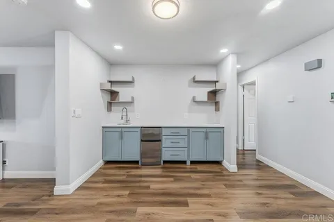a kitchen with stainless steel appliances a refrigerator and a sink