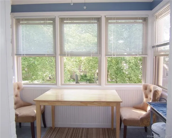 a living room with a large window and a table