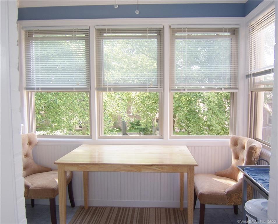 37 Rowsley Street, Unit 6 Bridgeport, CT 06605 - Photo 5 of 17 a living room with a large window and a table
