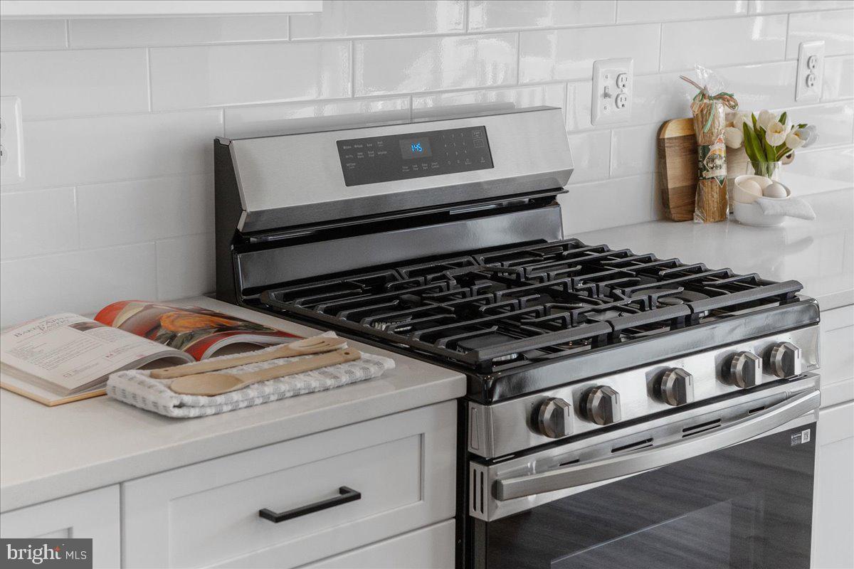 641 Swallowtail Drive Frederick, MD 21703 - Photo 19 of 52 a stove top oven sitting inside of a kitchen