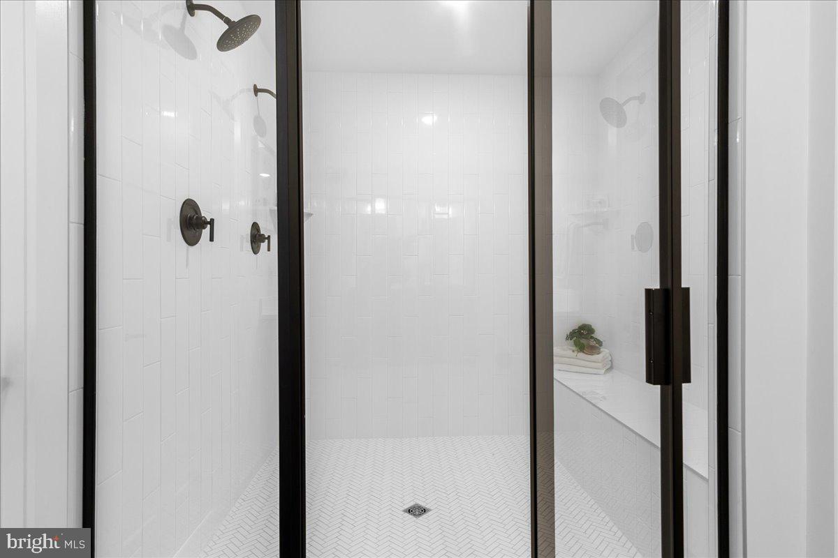 641 Swallowtail Drive Frederick, MD 21703 - Photo 30 of 52 a bathroom with a glass shower door