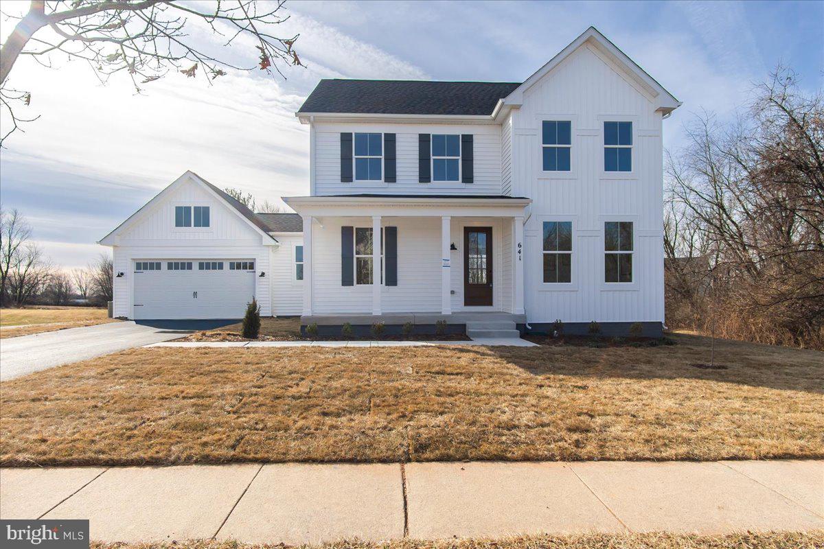 641 Swallowtail Drive Frederick, MD 21703 - Photo 3 of 52 a house that has a tree in front of it