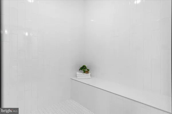 a bathroom with a double vanity sink and mirror