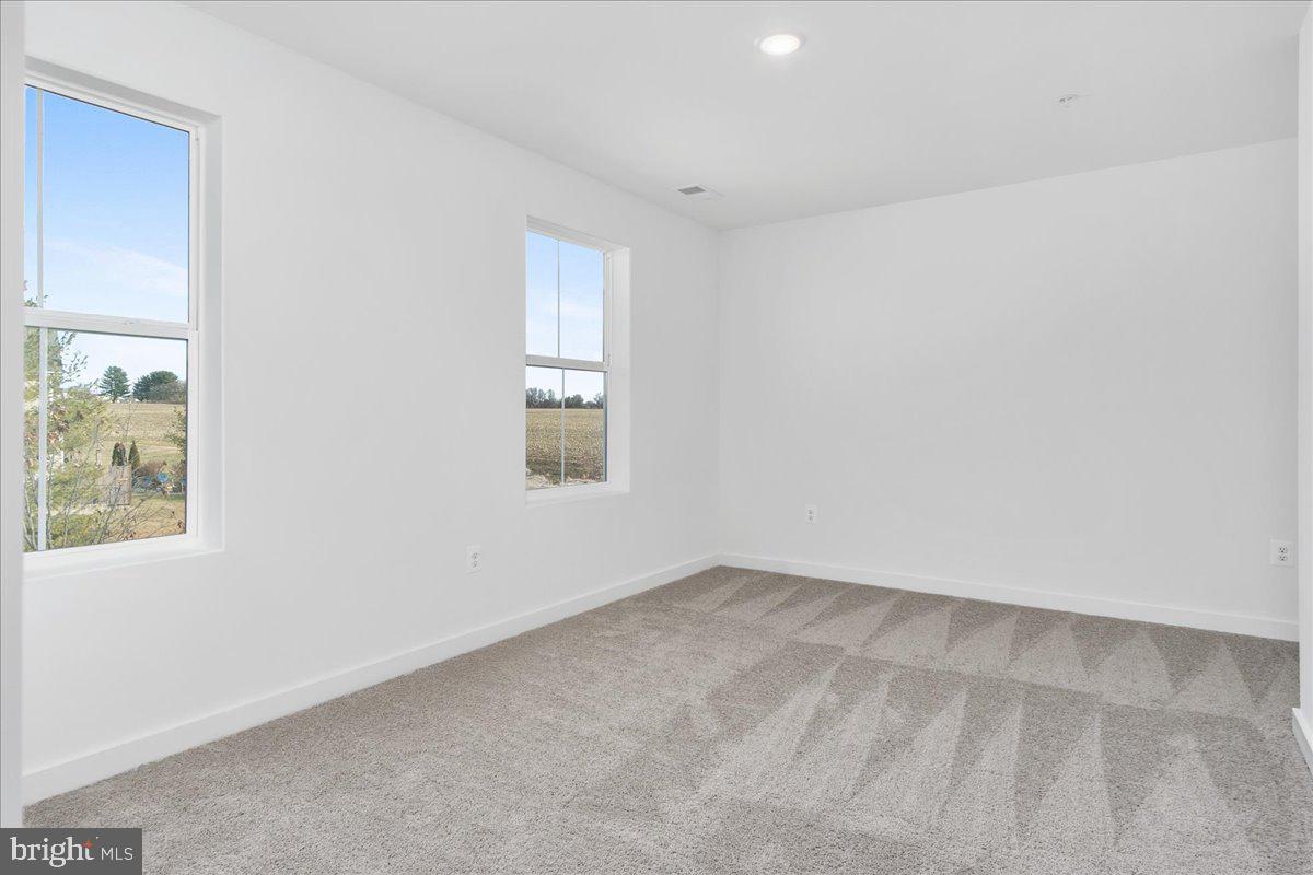 641 Swallowtail Drive Frederick, MD 21703 - Photo 36 of 52 an empty room with windows