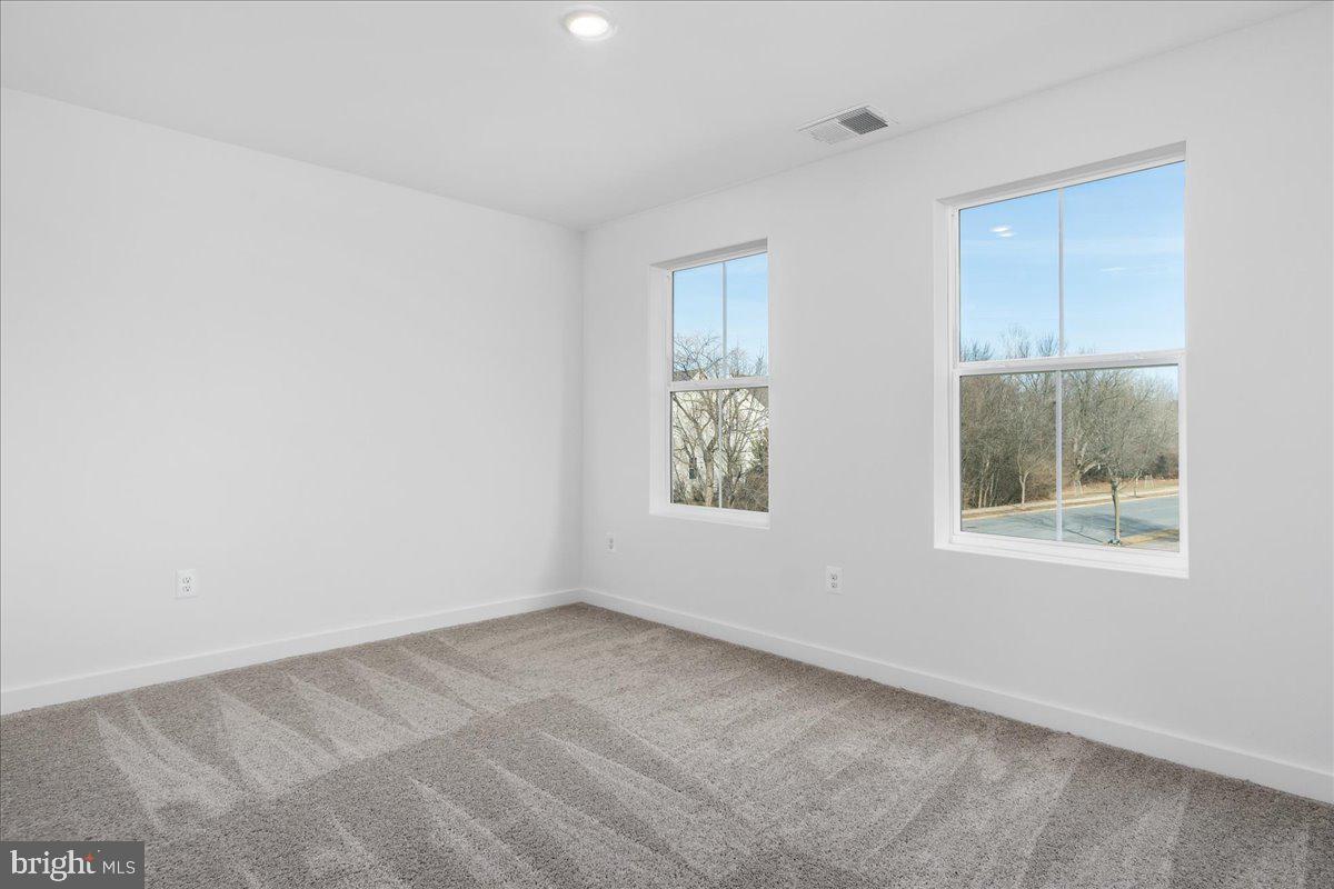641 Swallowtail Drive Frederick, MD 21703 - Photo 37 of 52 an empty room with windows