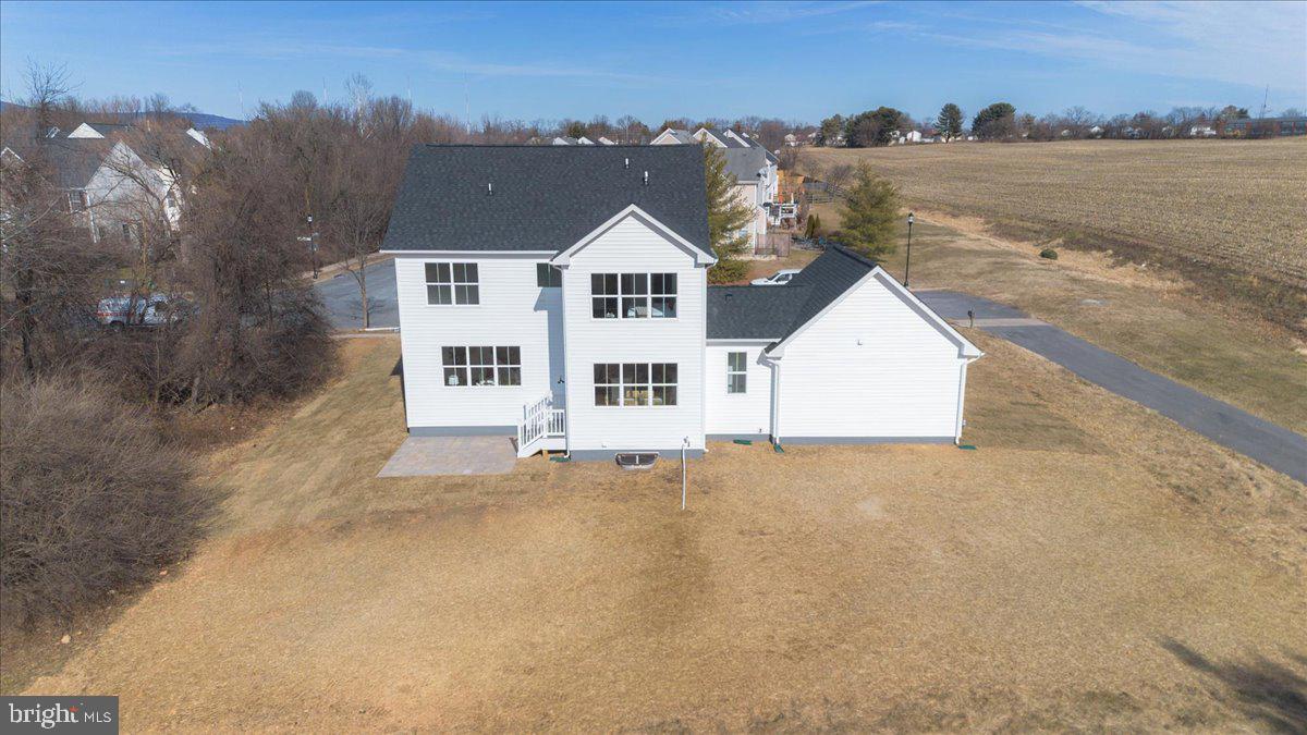 641 Swallowtail Drive Frederick, MD 21703 - Photo 46 of 52 a view of a big house with a mountain in the background