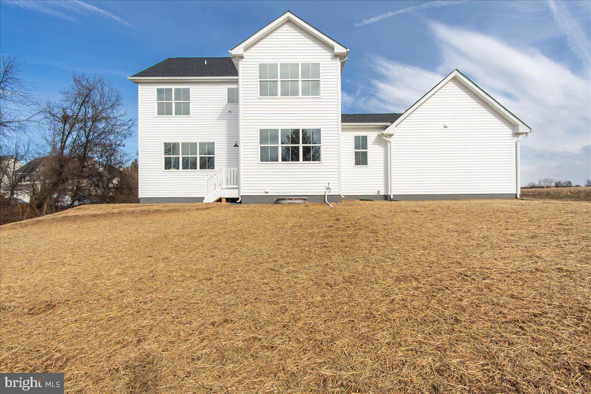 641 Swallowtail Drive Frederick, MD 21703 - Photo 47 of 52 a view of a big house with wooden floor and a yard